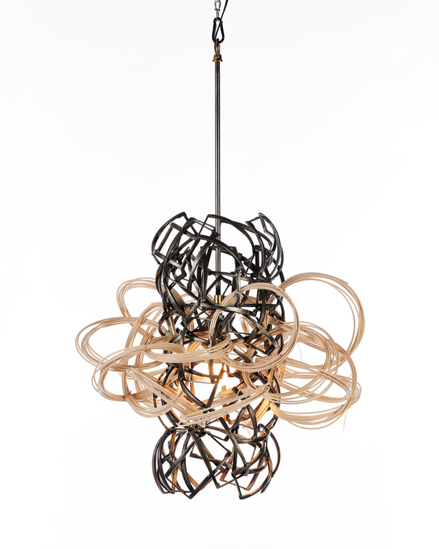 Lucy Slivinski Interior Lighting "Orbital Being"
recycled steel objects, wooden reed
20.5" X 24" X 23"