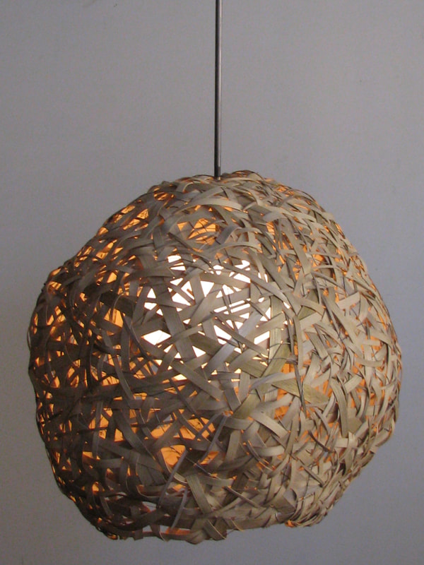Lucy Slivinski Interior Lighting "Sphere 2"
woven wood reed, stainless steel wire, electric light, glass sphere
28"D