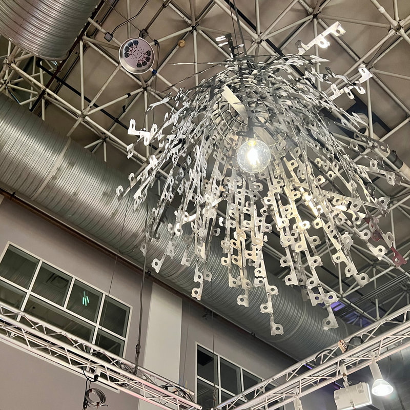 Suspended artistic lighting created by Lucy Slivinski at Art Expo Chicago.