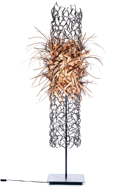 Lucy Slivinski Interior Lighting "Tempest"
recycled steel objects, wooden reed
88''x41''x39''